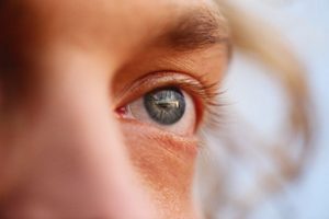 Closeup of someone's eye, looking into the distance