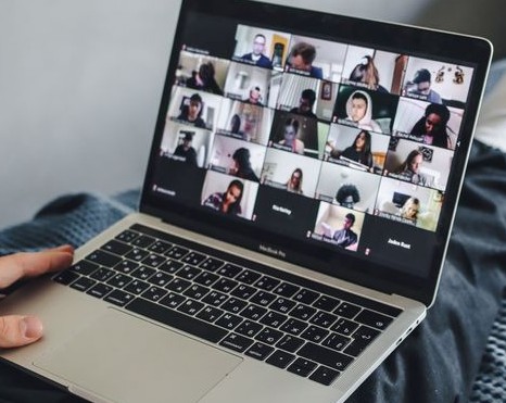 Laptop with Brainy Bunch attendees displayed on the screen
