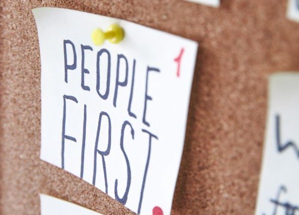 Bulletin Board with "people first" pinned