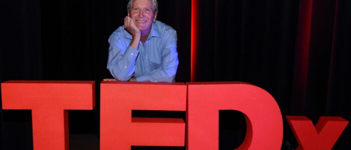 Jim relaxing on TEDx logo